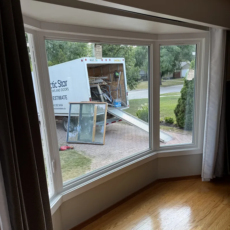 Bay window seen from inside, with the old windows going into the Arctic Star truck