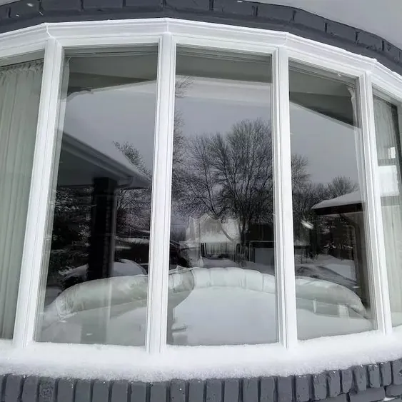 Bow window on grey siding
