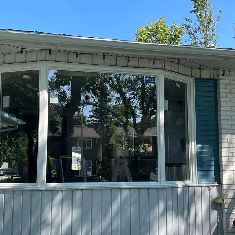 Bow window on blue siding