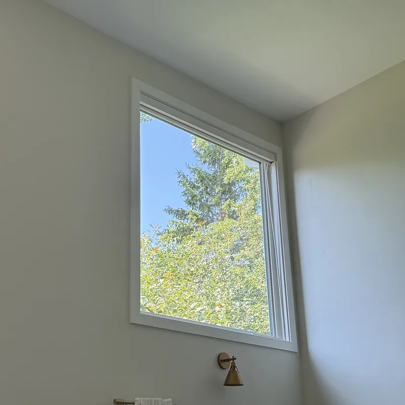 High picture window in a two-storey living room