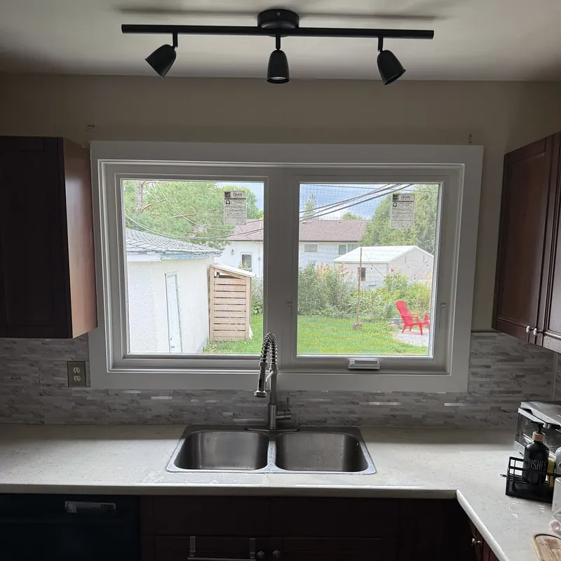 Kitchen window over the sink, with a fixed pane and a crank-out sash