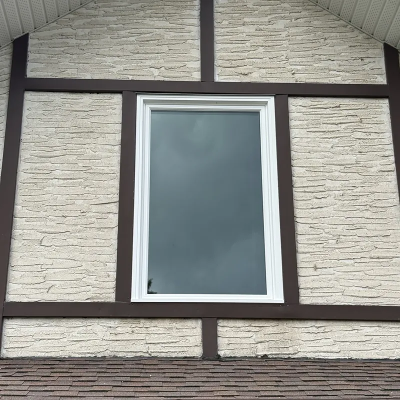 Picture window in a Tudor-style gable