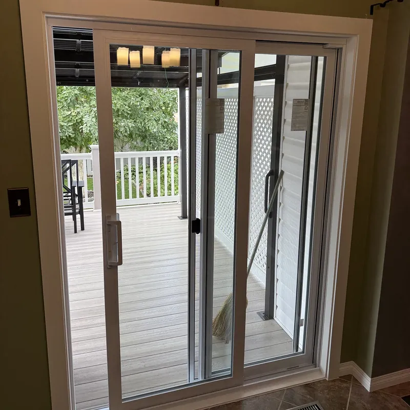 Sliding patio door seen from inside, opening onto a covered deck