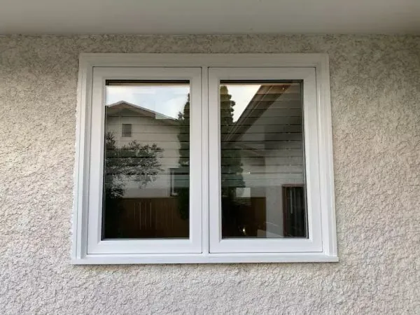 Double casement window on stucco