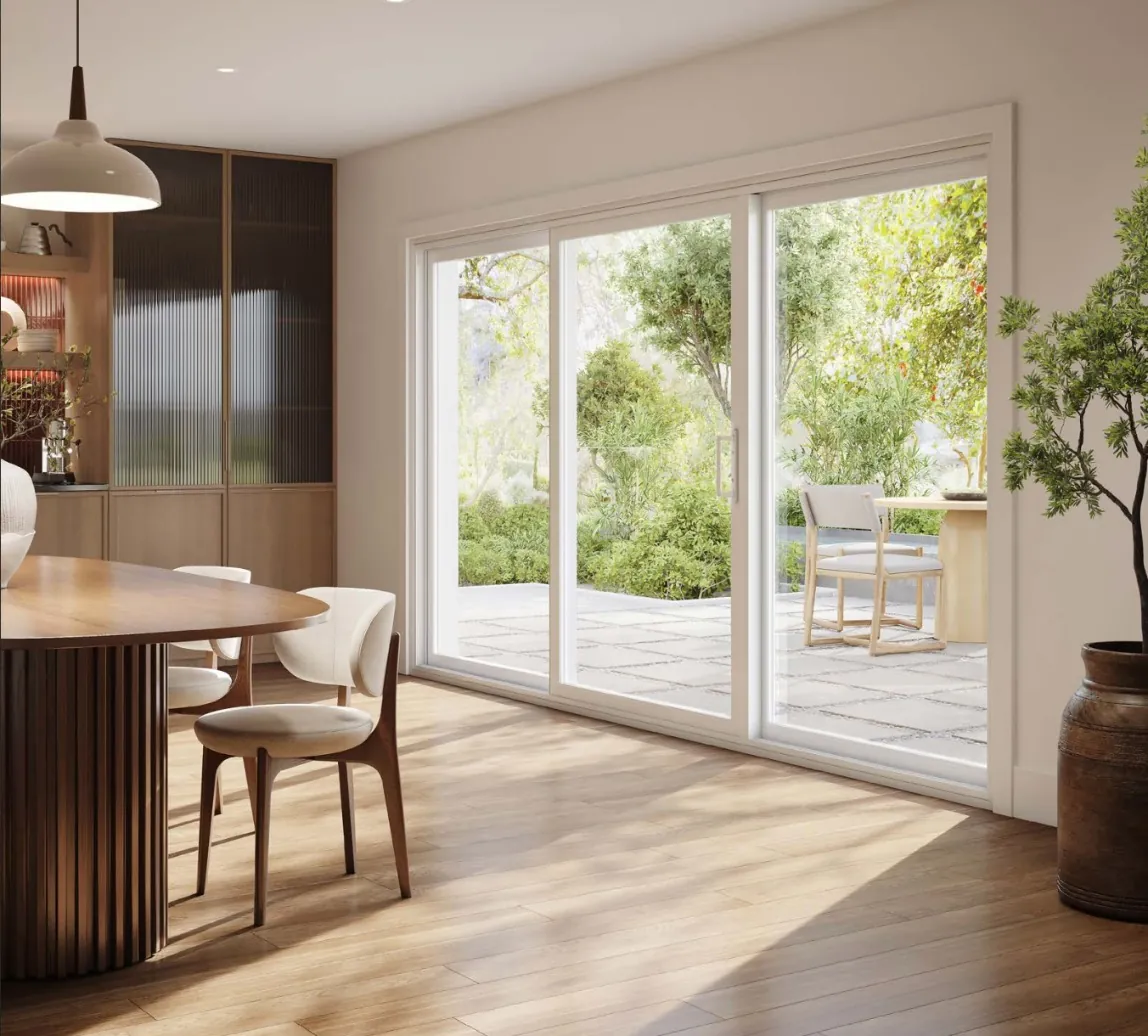 Novatech 550 three-panel sliding patio door opening onto a garden patio