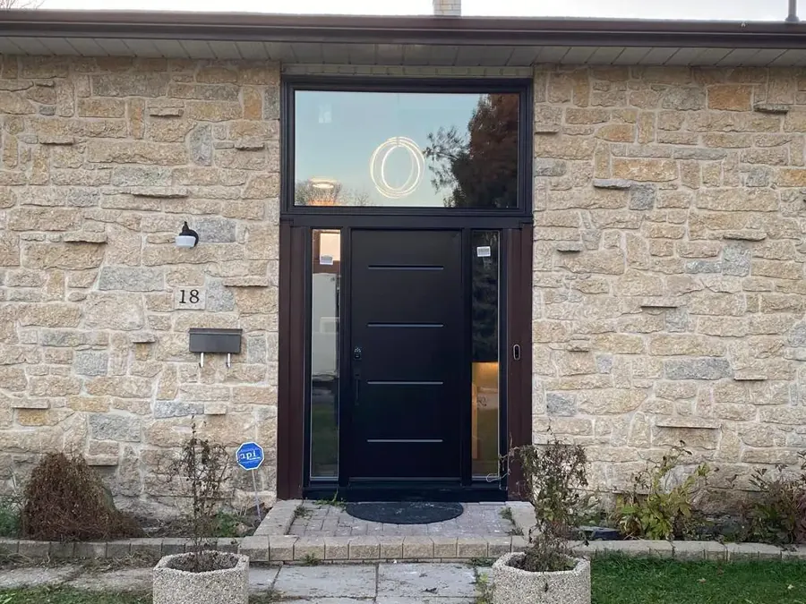 Black entry door installed in Winnipeg by Arctic Star Windows